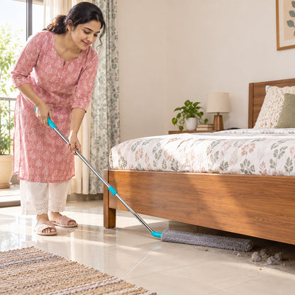 Indian woman cleaning under a bed with SafaiSakhi FlexReach